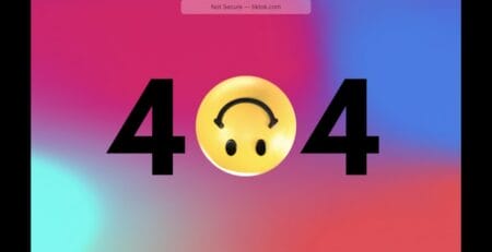 404 error screen with an upside-down smiley face as the zero on a pink–purple–blue gradient background.