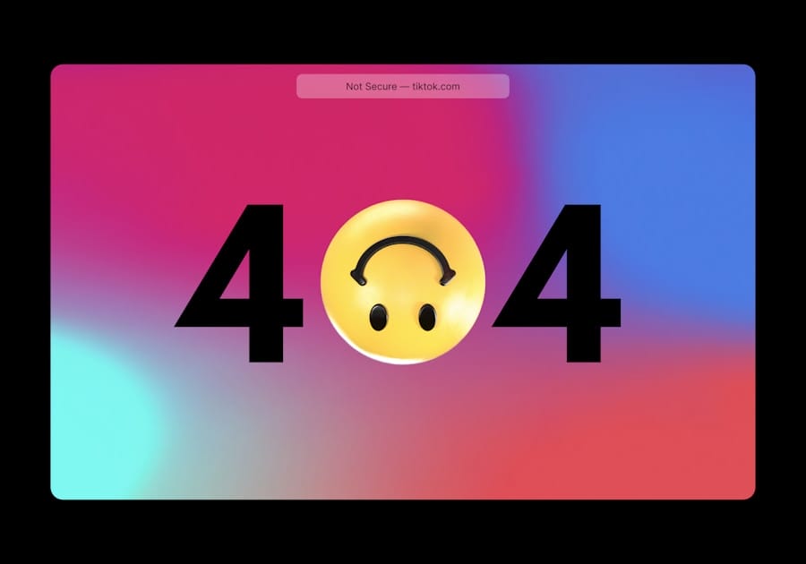 404 error screen with an upside-down smiley face as the zero on a pink–purple–blue gradient background.